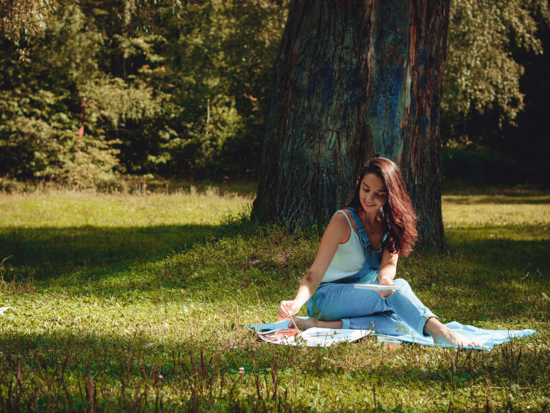 Woman painting in park